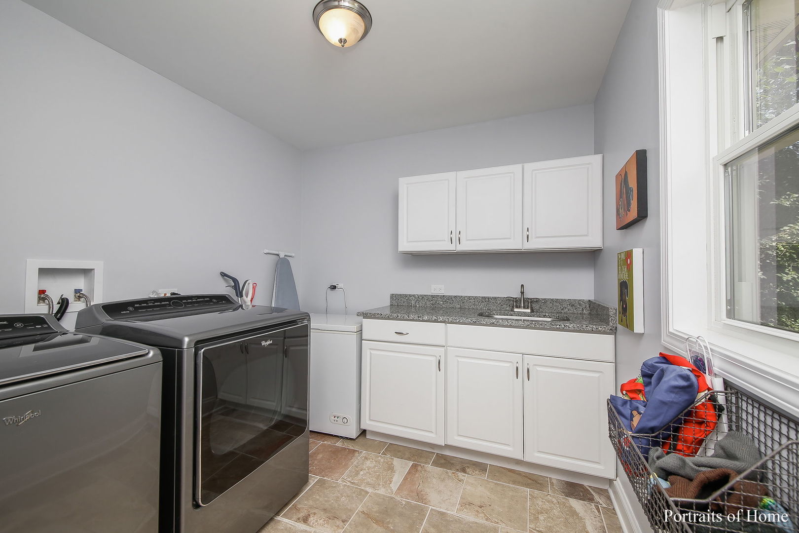 231 Highland Road Willowbrook, IL 60527 - Photo 12 of 38 a kitchen with stainless steel appliances granite countertop a stove sink and cabinets