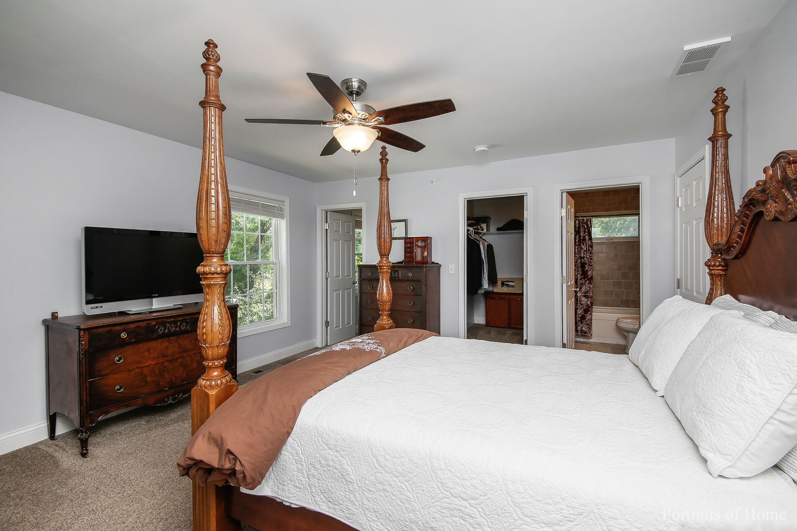 231 Highland Road Willowbrook, IL 60527 - Photo 14 of 38 a bedroom with a bed and a flat screen tv