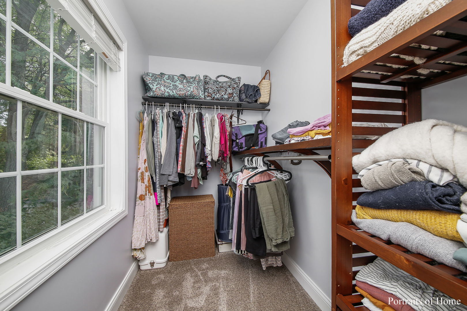 231 Highland Road Willowbrook, IL 60527 - Photo 16 of 38 a view of walk in closet with clothes and shoes