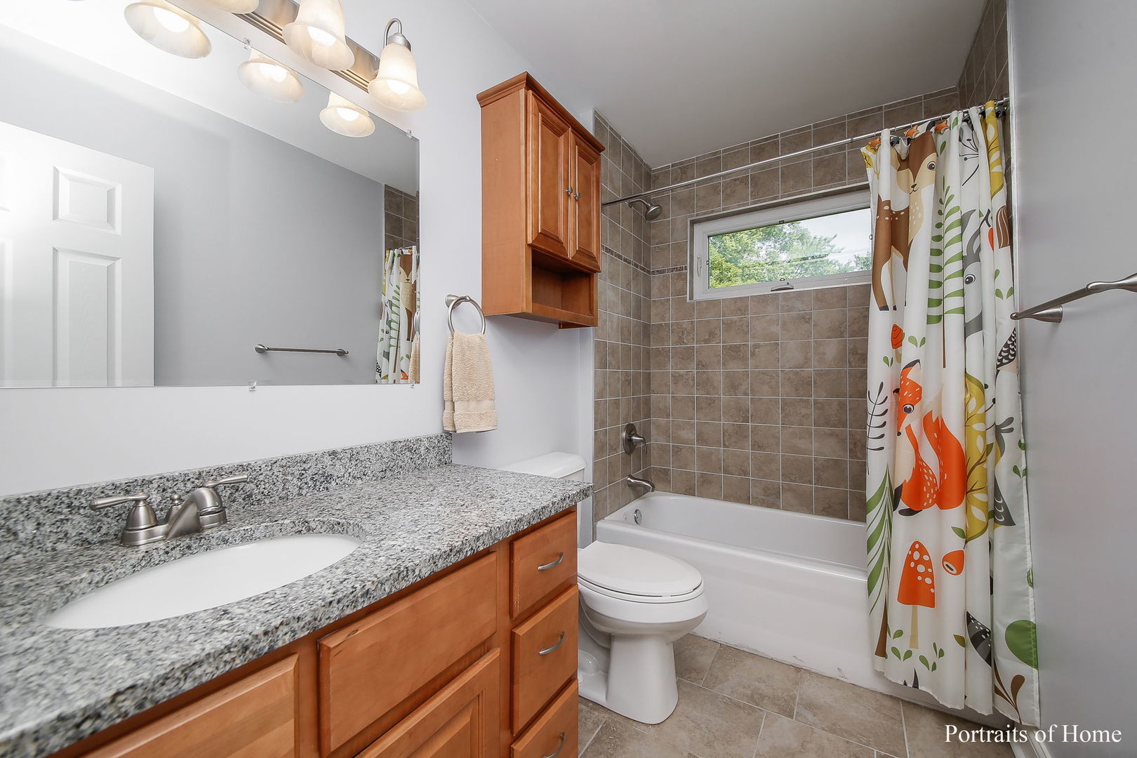 231 Highland Road Willowbrook, IL 60527 - Photo 19 of 38 a bathroom with a granite countertop sink a toilet tub and shower