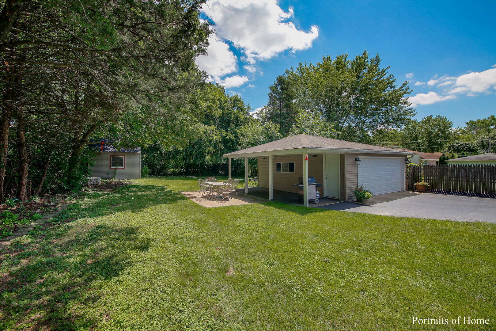 231 Highland Road Willowbrook, IL 60527 - Photo 23 of 38 a view of a house with a yard and sitting area