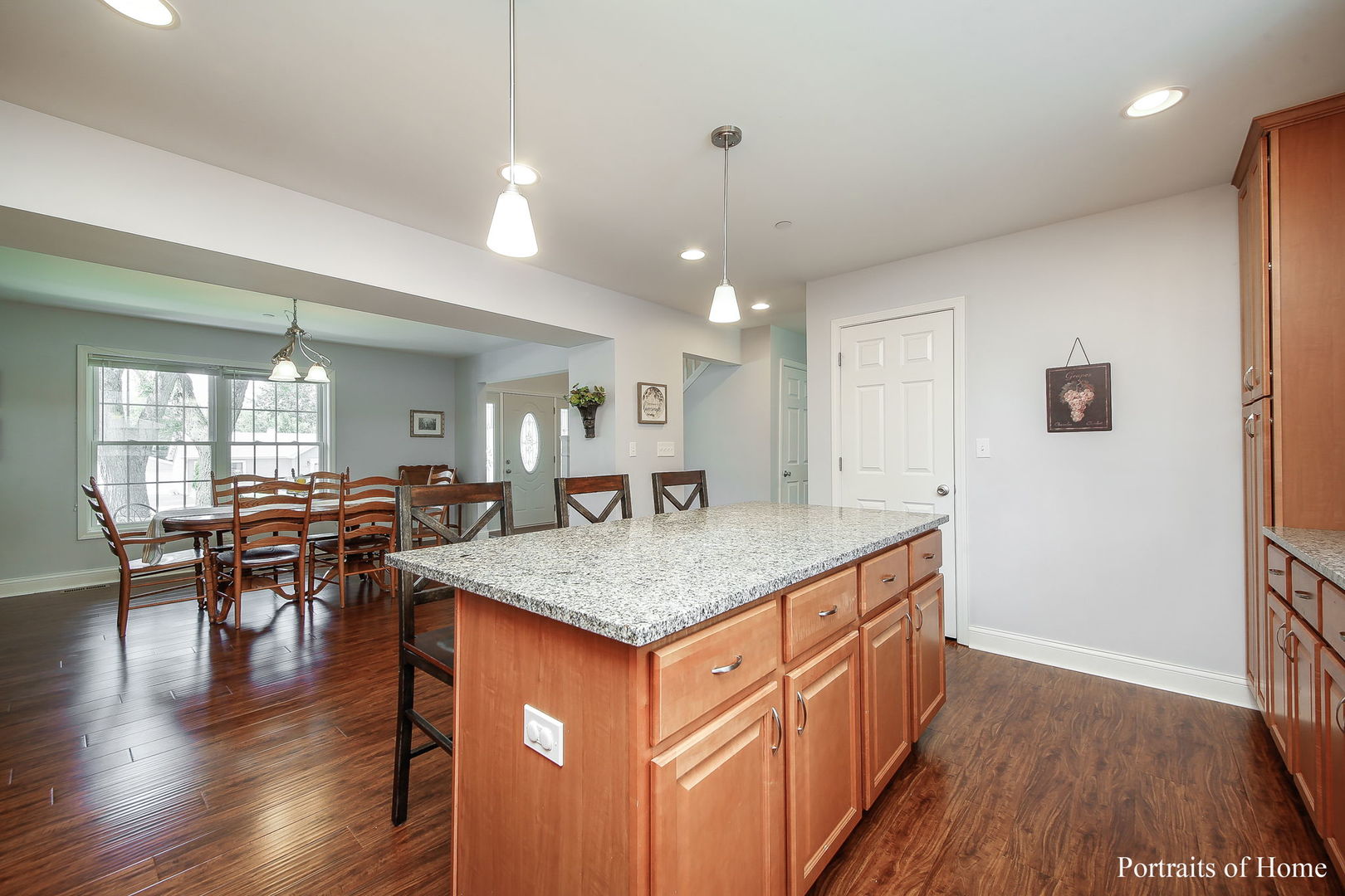 231 Highland Road Willowbrook, IL 60527 - Photo 8 of 38 a kitchen with a counter space dining table and chairs