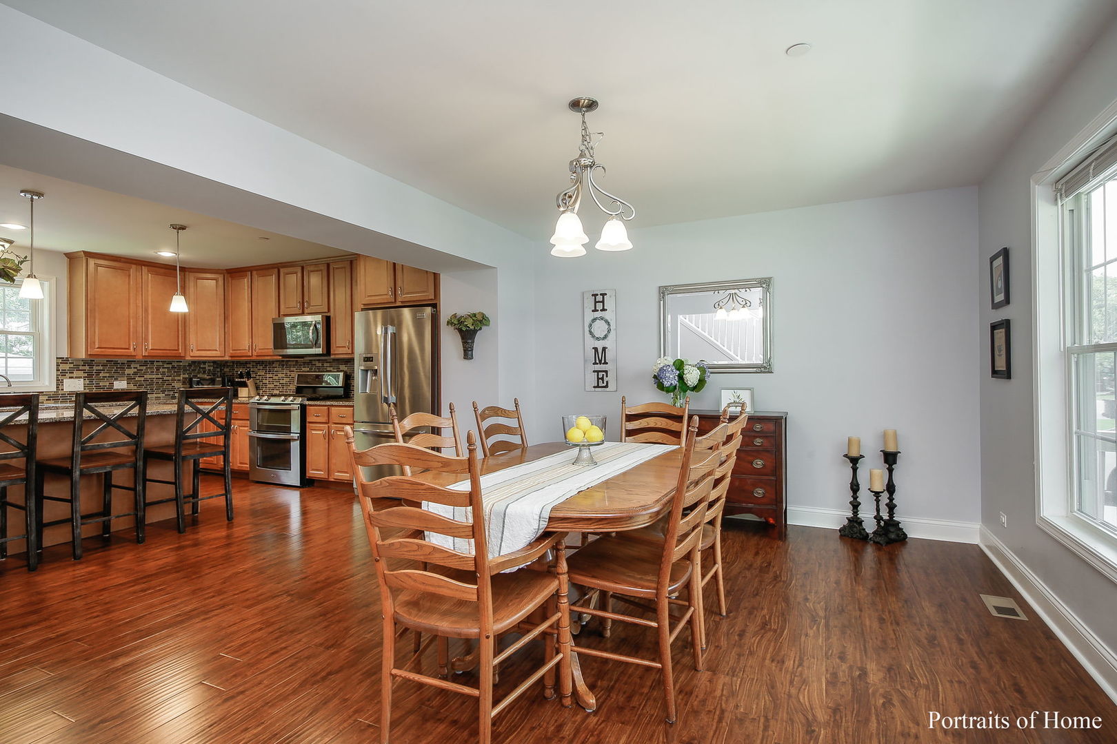 231 Highland Road Willowbrook, IL 60527 - Photo 9 of 38 a view of a dining room with furniture and wooden floor