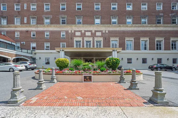 a view of a building with sitting area