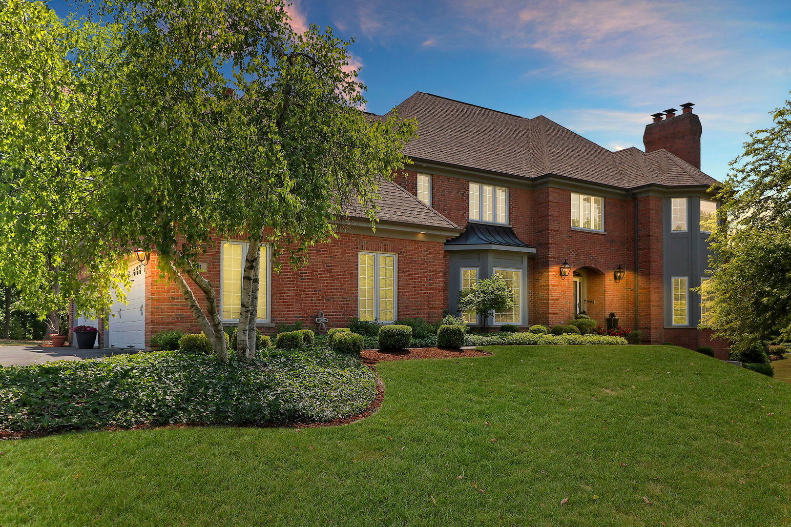a front view of a house with a yard