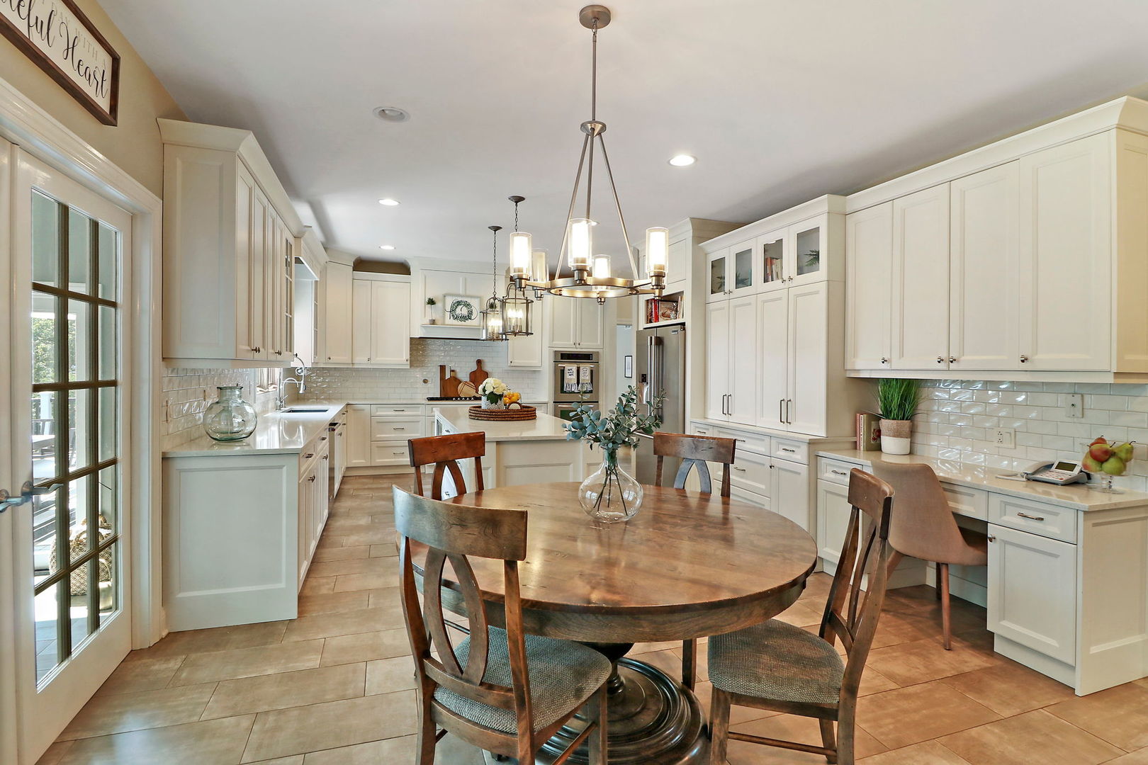 31 Overbrook Road South Barrington, IL 60010 - Photo 12 of 65 a dining room with stainless steel appliances kitchen island granite countertop a dining table chairs and view kitchen