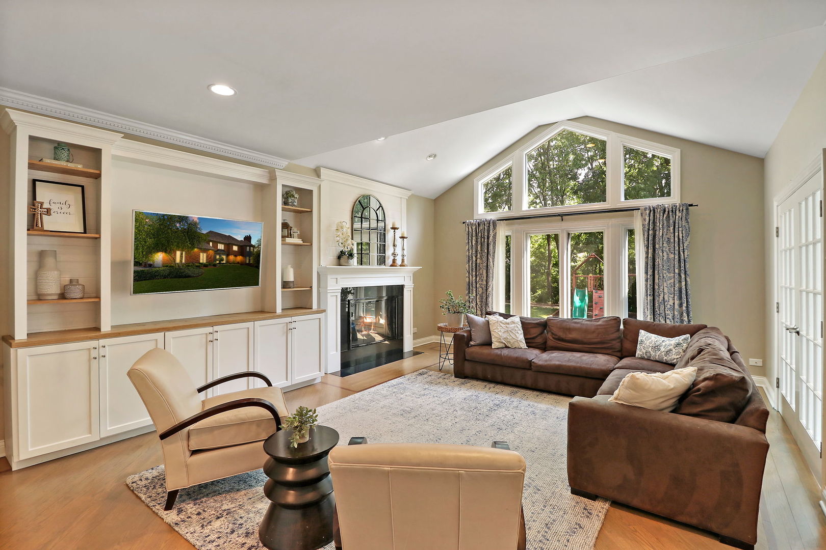 31 Overbrook Road South Barrington, IL 60010 - Photo 15 of 65 a living room with furniture a fireplace and a flat screen tv
