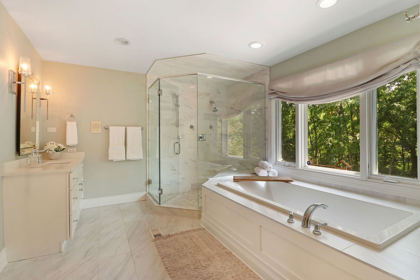 31 Overbrook Road South Barrington, IL 60010 - Photo 37 of 65 a bathroom with a tub sink a mirror and a shower