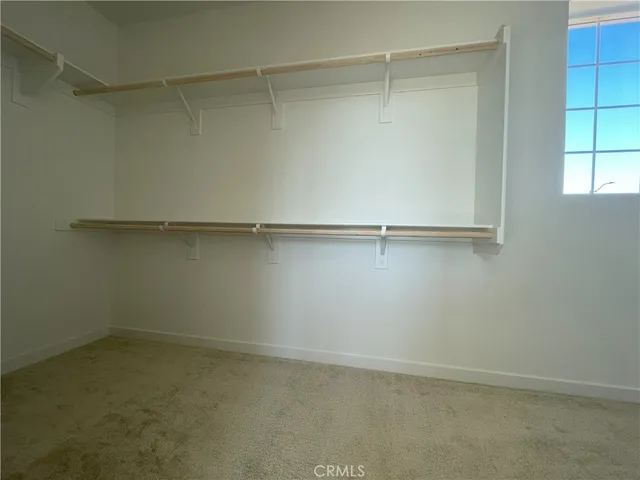 a spacious bathroom with a sink mirror and a bathtub