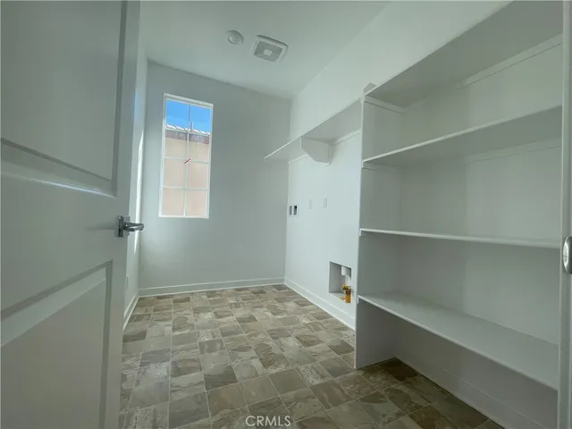 a bathroom with a granite countertop toilet sink and mirror