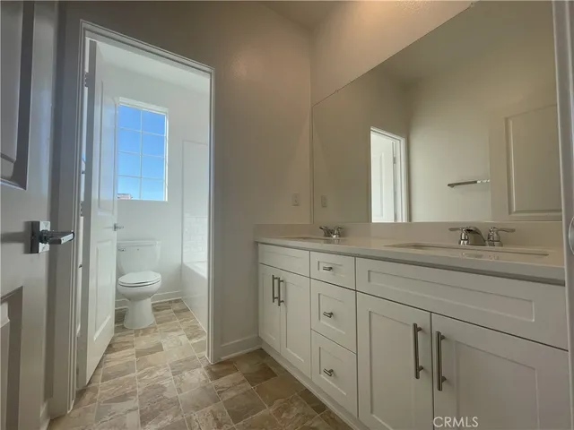 an empty room with a empty space and windows