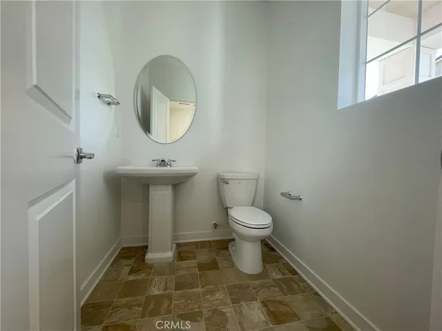 a bathroom with a toilet and a sink