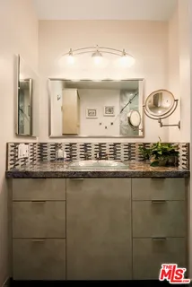 a kitchen with a stove a refrigerator and a sink