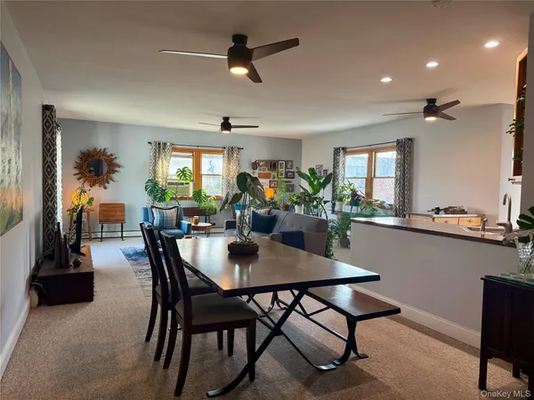 a dining room with furniture and window