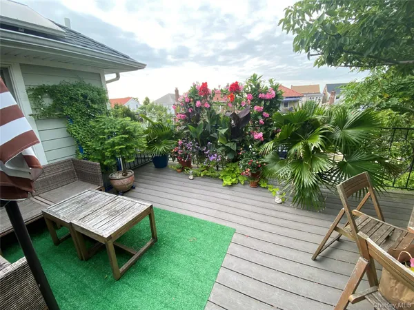 a view of a backyard with sitting area