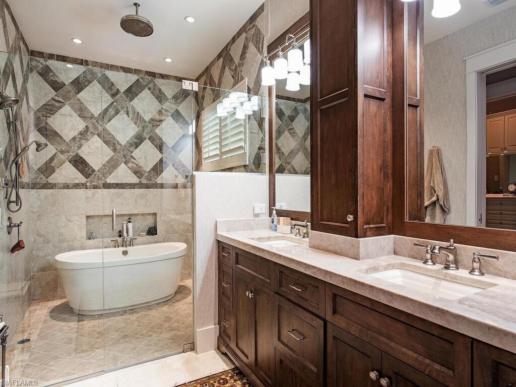 1482 2nd Avenue South Naples, FL 34102 - Photo 12 of 25 a bathroom with a double vanity sink mirror and bathtub