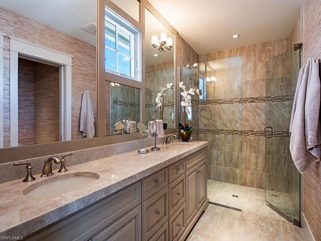 1482 2nd Avenue South Naples, FL 34102 - Photo 16 of 25 a bathroom with a double vanity sink mirror and shower