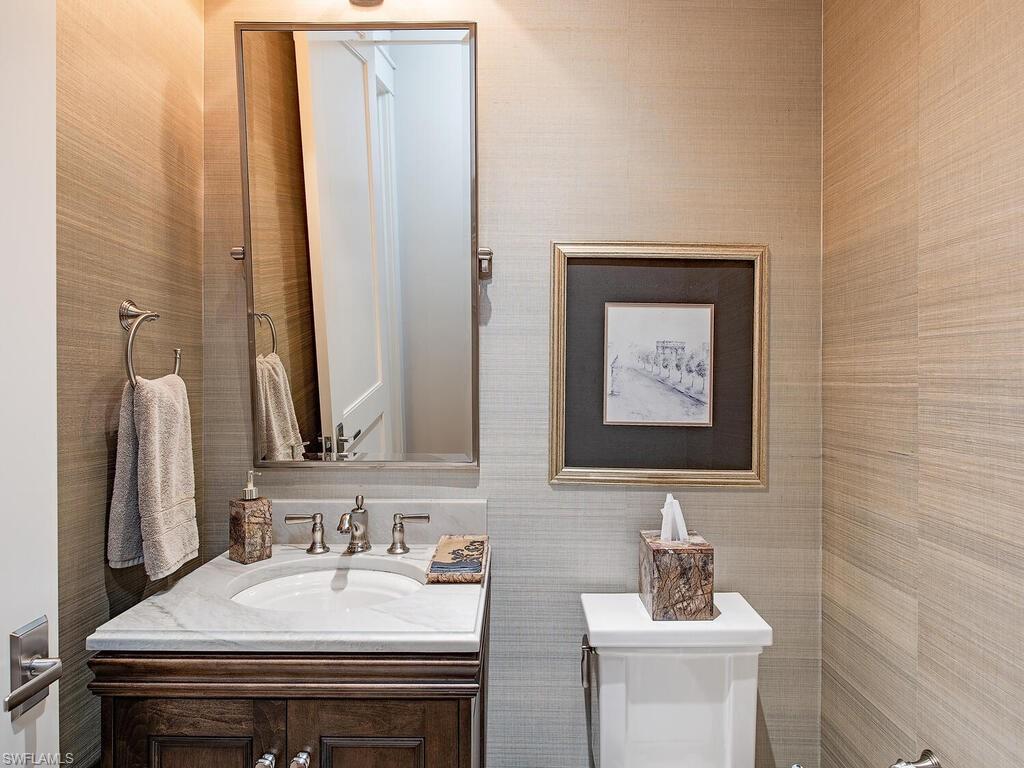 1482 2nd Avenue South Naples, FL 34102 - Photo 19 of 25 a bathroom with a sink and a mirror