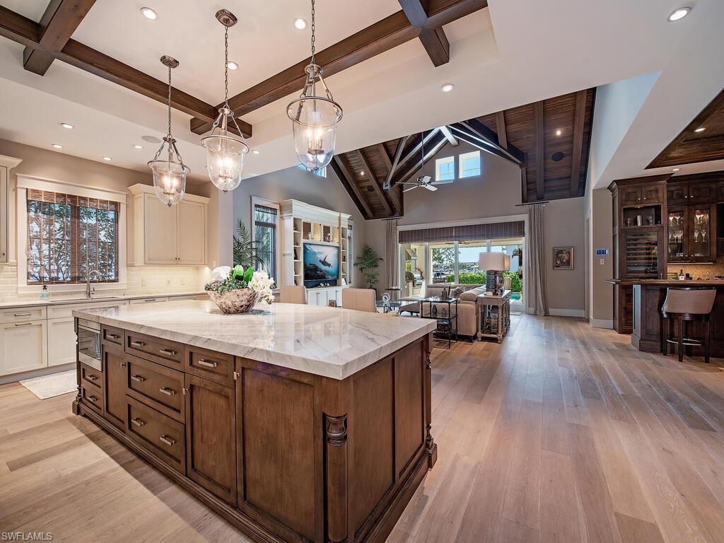 1482 2nd Avenue South Naples, FL 34102 - Photo 3 of 25 a large kitchen with kitchen island a large island in it