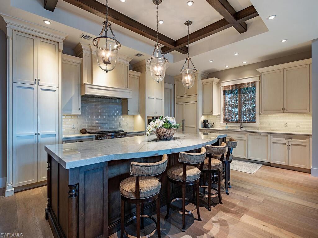 1482 2nd Avenue South Naples, FL 34102 - Photo 4 of 25 a kitchen with a table and chairs in it