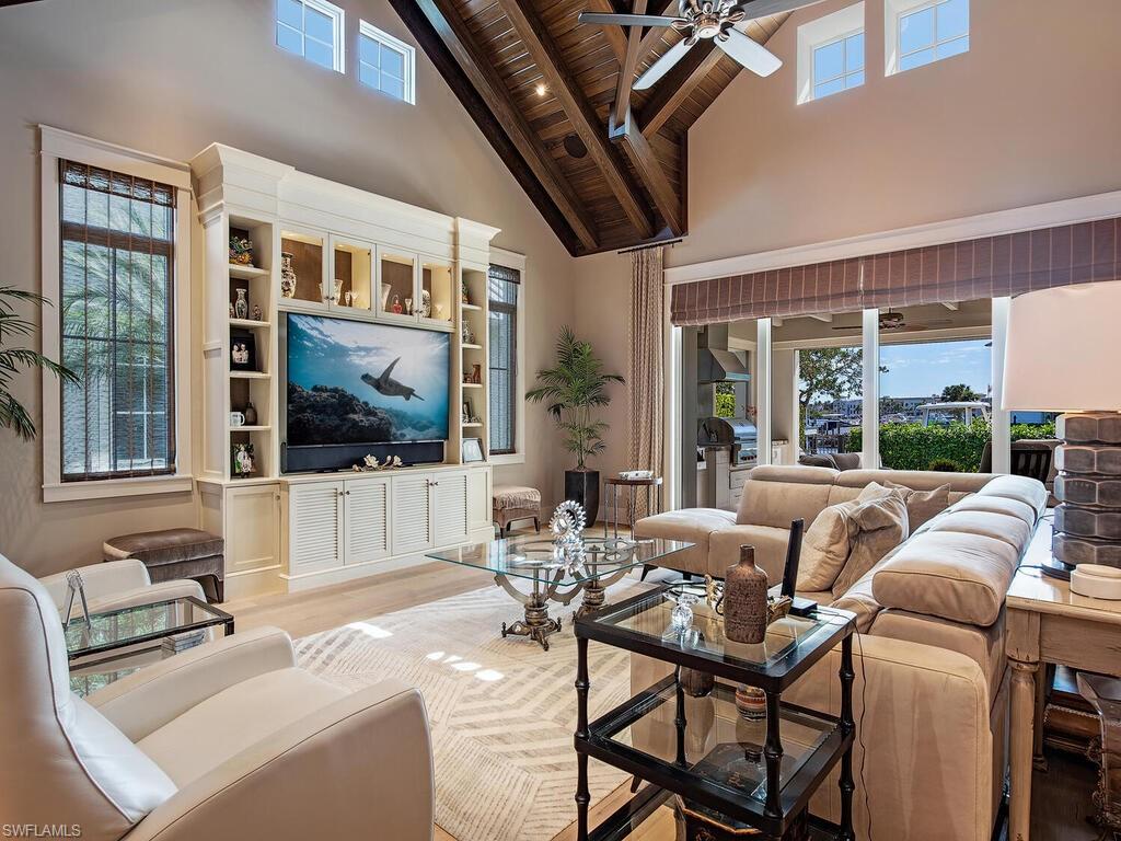 1482 2nd Avenue South Naples, FL 34102 - Photo 7 of 25 a living room with furniture and a flat screen tv