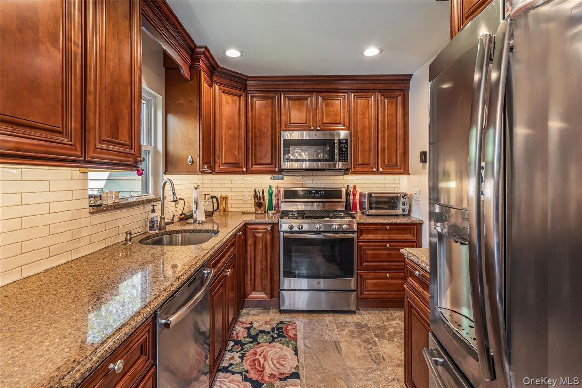 80 Russell Road Garden City, NY 11530 - Photo 8 of 25 Kitchen with Stainless Steel Appliances