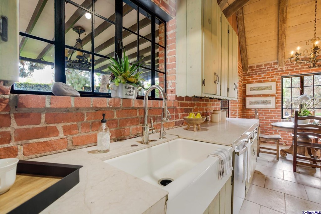 1705 Rancho Avenue Glendale, CA 91201 - Photo 22 of 53 a bathroom with a double vanity sink and a large mirror