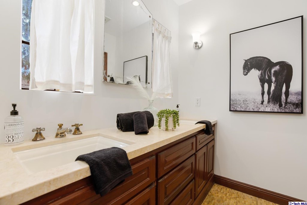 1705 Rancho Avenue Glendale, CA 91201 - Photo 28 of 53 a bathroom with a sink and a mirror