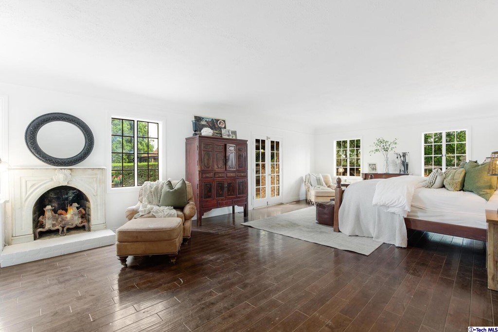 1705 Rancho Avenue Glendale, CA 91201 - Photo 29 of 53 a living room with furniture a fireplace and a floor to ceiling window