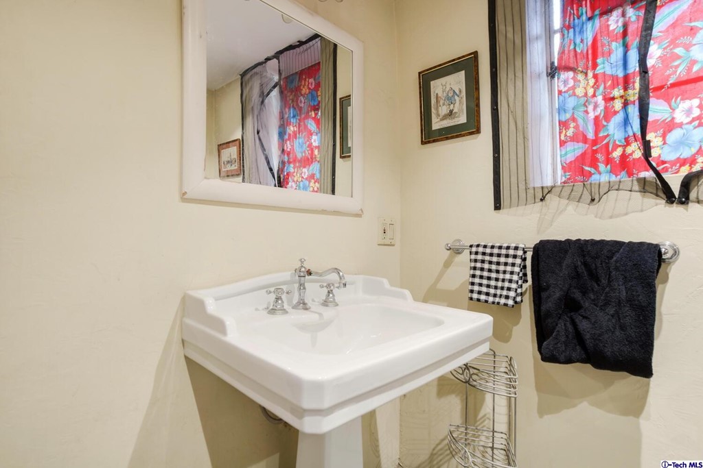 1705 Rancho Avenue Glendale, CA 91201 - Photo 42 of 53 a bathroom with a sink and a mirror