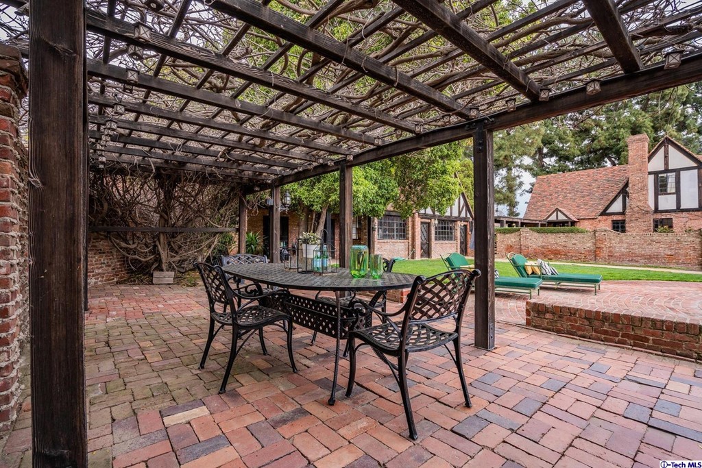 1705 Rancho Avenue Glendale, CA 91201 - Photo 49 of 53 a view of a patio with a table chairs and a backyard