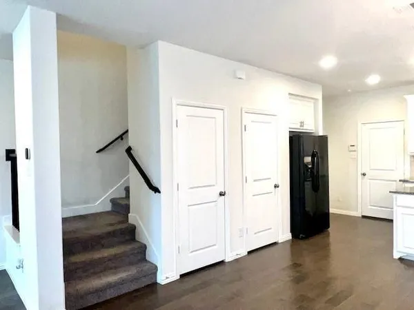 a view of entryway with wooden floor and stairs