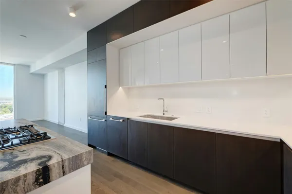 a kitchen with a sink and cabinets