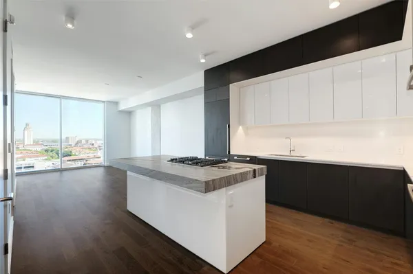 a kitchen with a stove and a sink