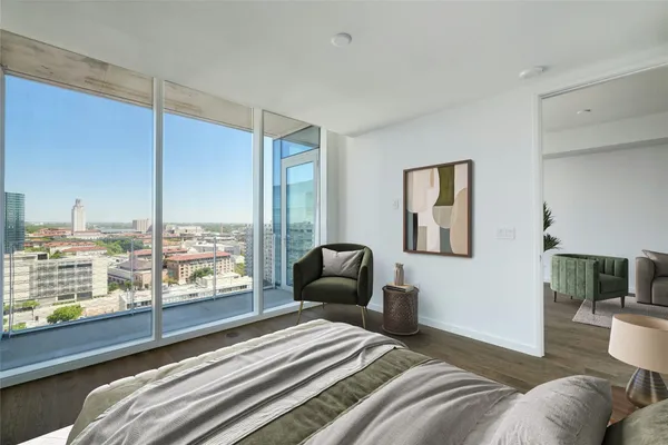 a bedroom with a bed and glass window