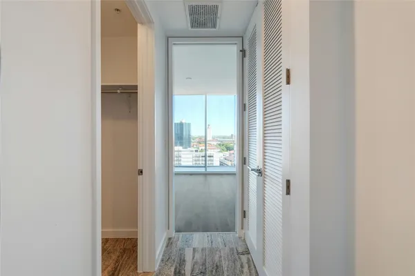 a view of a bathroom from a hallway