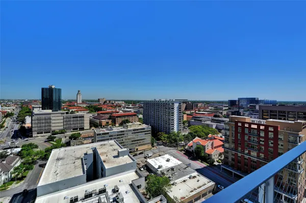 a view of a balcony with city view