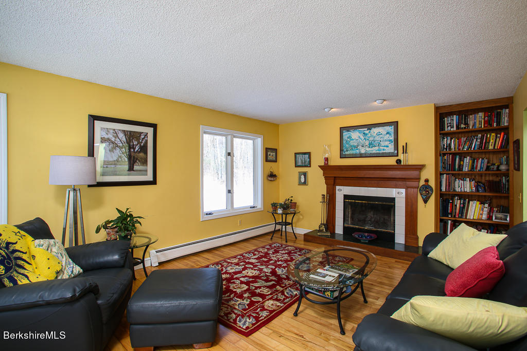 316 Johnson Hill Road Washington, MA 01223 - Photo 8 of 24 a living room with furniture and a fireplace