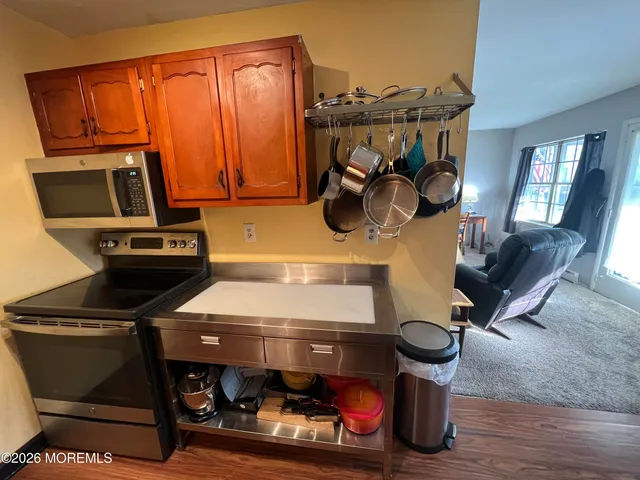 a kitchen with a stove and a microwave
