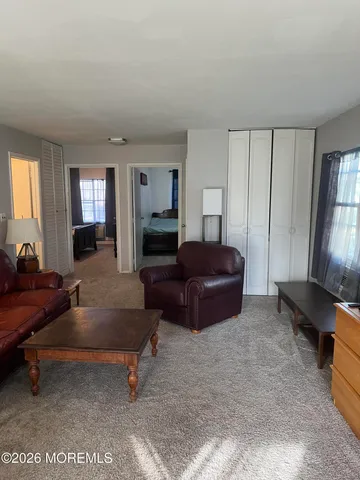 a living room with furniture window and a table