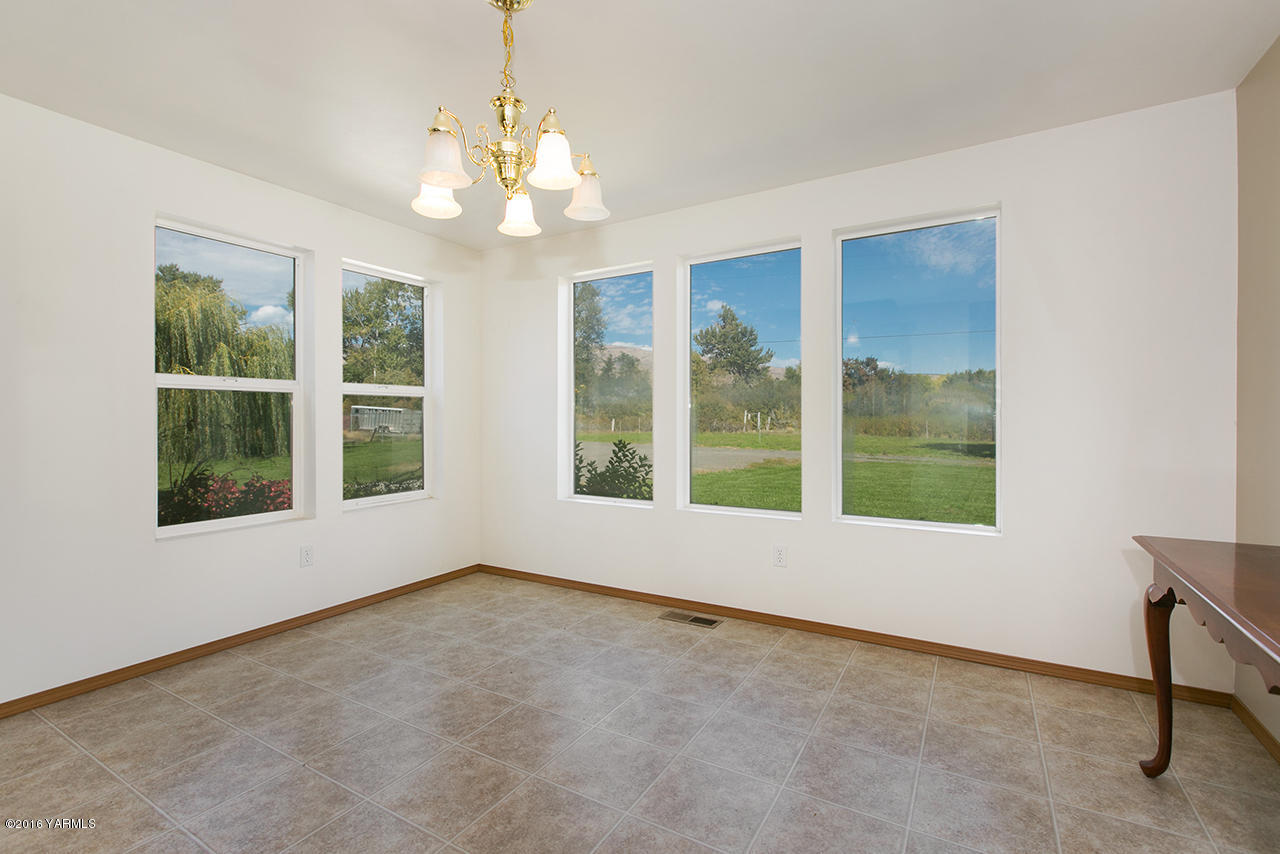 9645 South Naches Road Naches, WA 98937 - Photo 7 of 18 a view of an empty room with a window