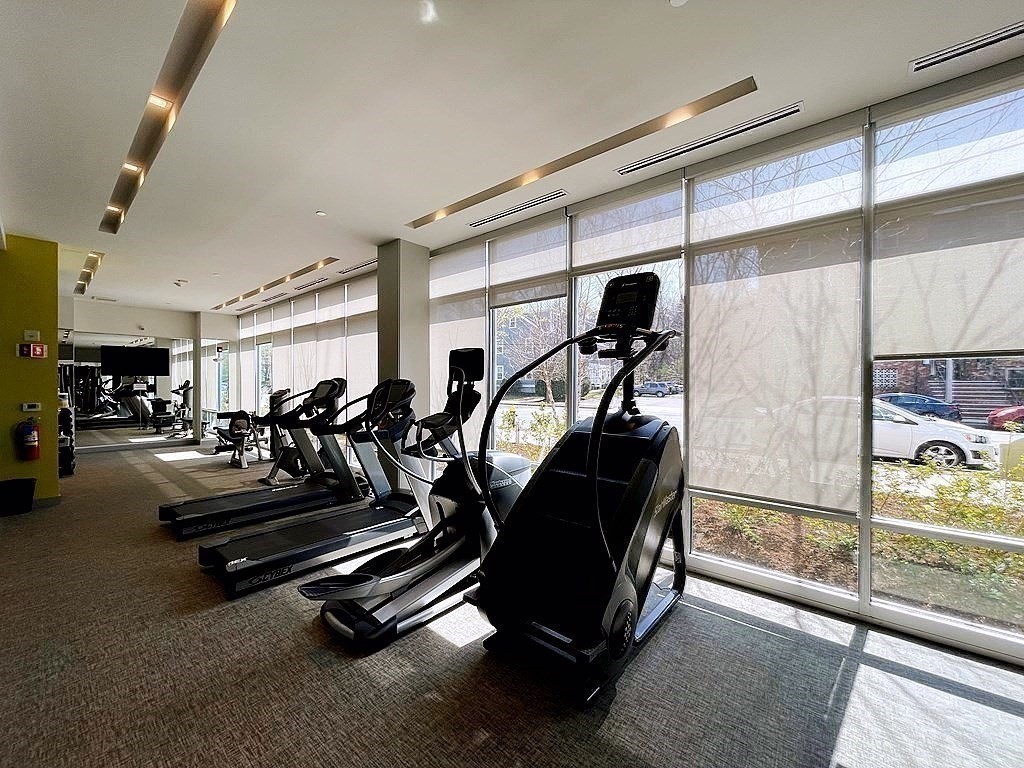 99 Tremont Street, Unit 313 Boston, MA 02135 - Photo 11 of 13 a view of a room with gym equipment