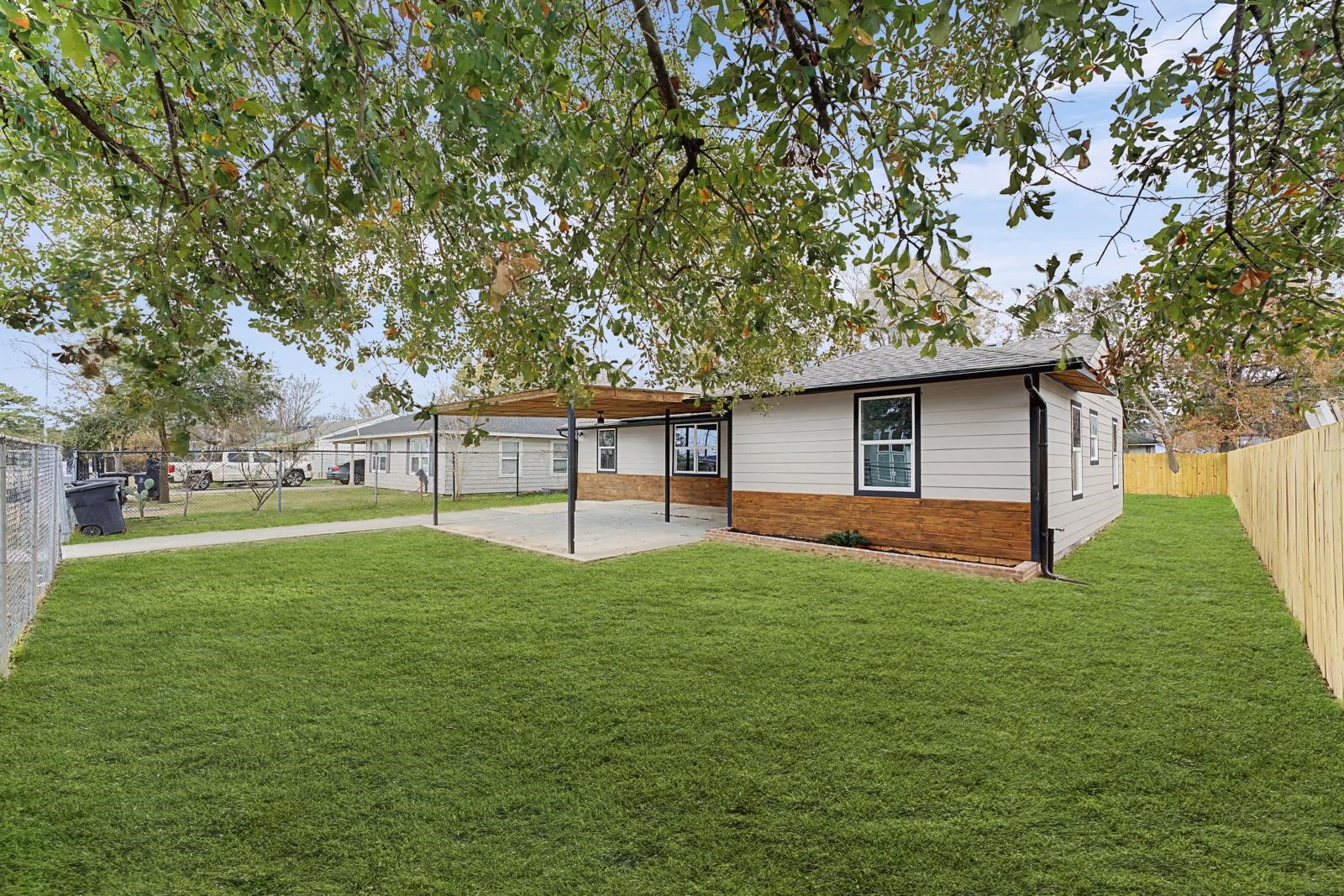 5719 Southwind Street Houston, TX 77033 - Photo 2 of 15 a view of a house with a backyard
