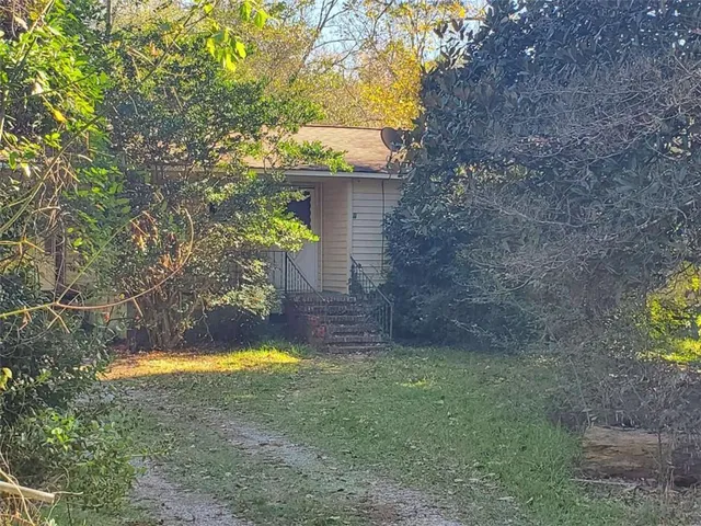 a view of a yard with swimming pool