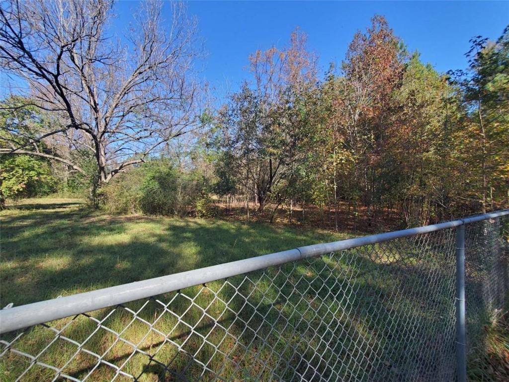 34 Ash Street Haddock, GA 31033 - Photo 17 of 24 a view of a roof deck with wooden fence