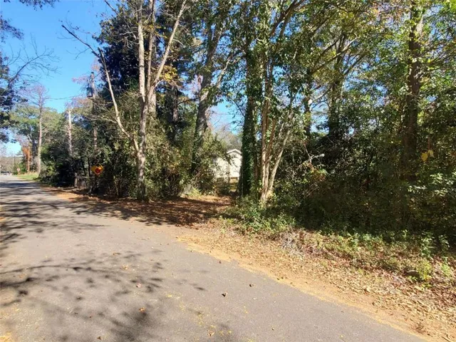 a view of a yard with an trees