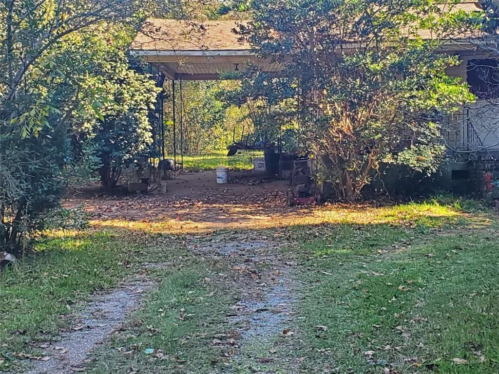 34 Ash Street Haddock, GA 31033 - Photo 4 of 24 a view of outdoor space yard and swimming pool