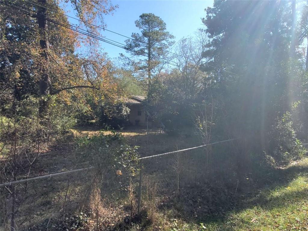 34 Ash Street Haddock, GA 31033 - Photo 7 of 24 a backyard of a house