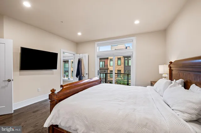 a en suite bathroom with a granite countertop sink mirror and shower