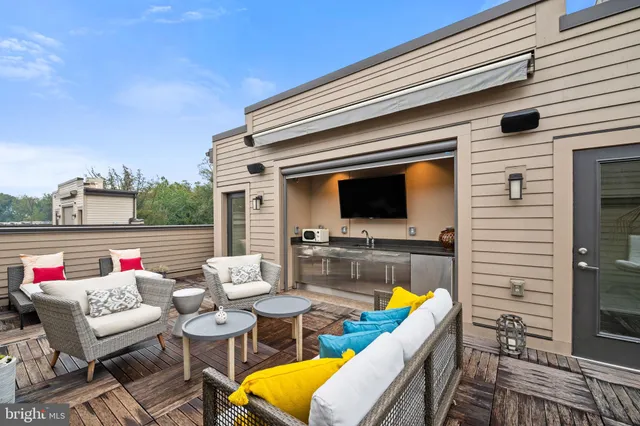 a view of a chairs and table in patio